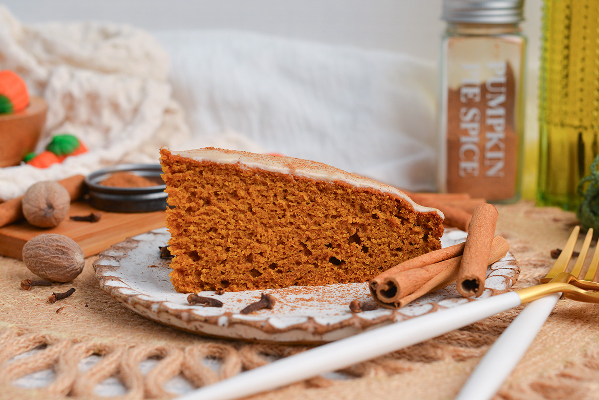 straight on shot of slice of pumpkin cake on plate