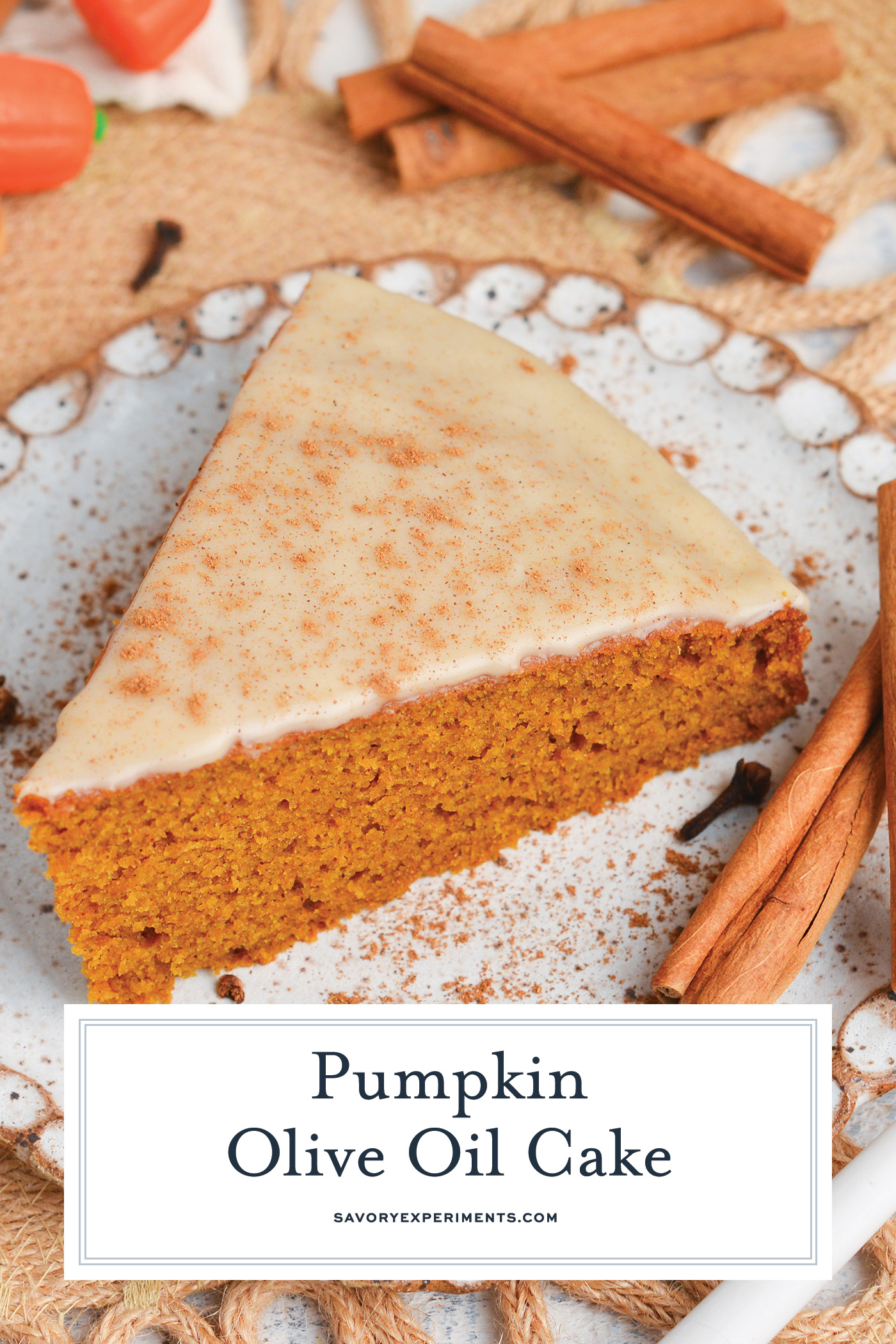 angled shot of slice of pumpkin olive oil cake on plate with text overlay