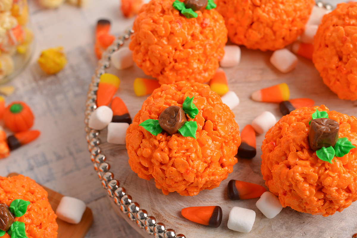 angled shot of rice krispie pumpkins on a tray