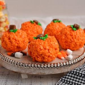 rice krispie pumpkins on a tray