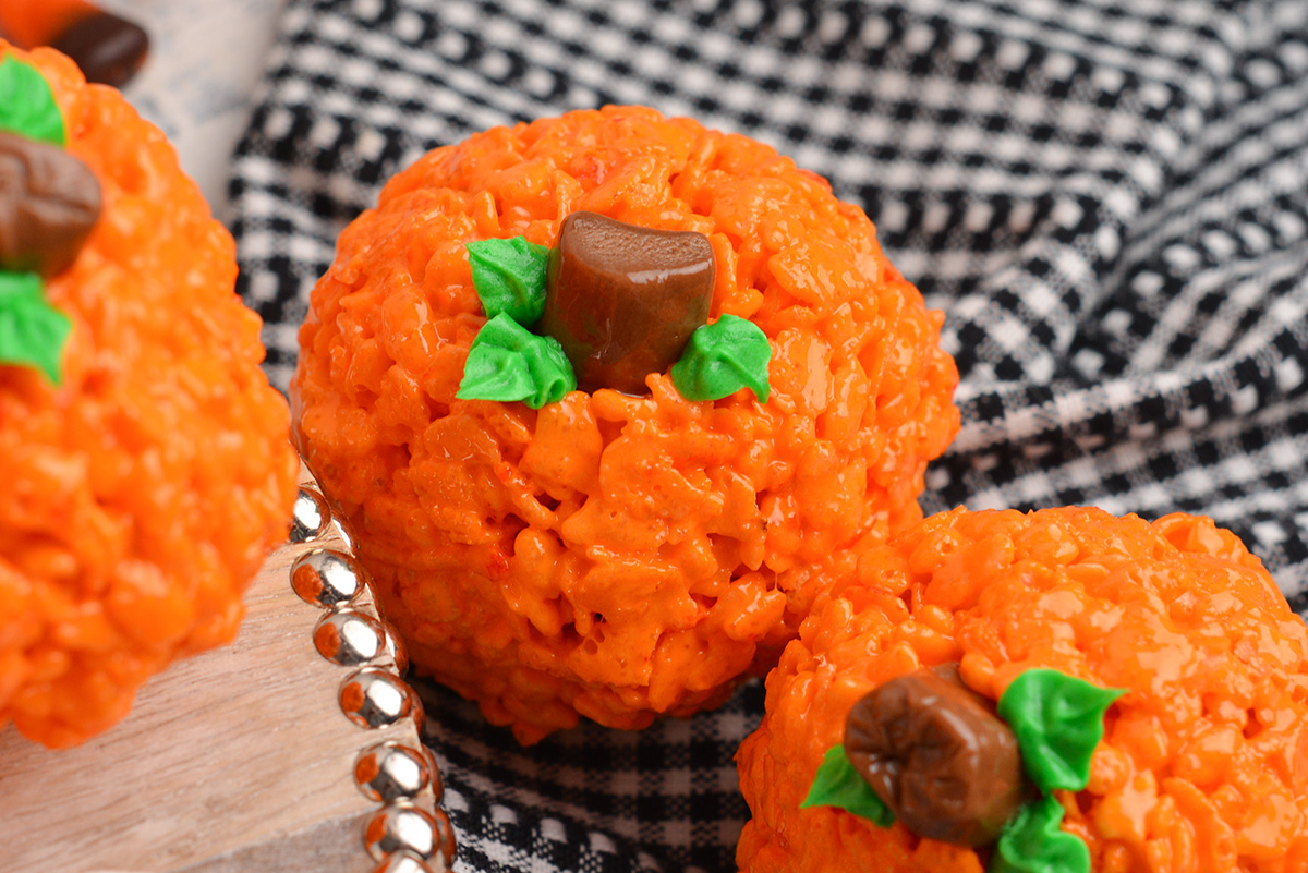 close up angled shot of rice krispie pumpkins