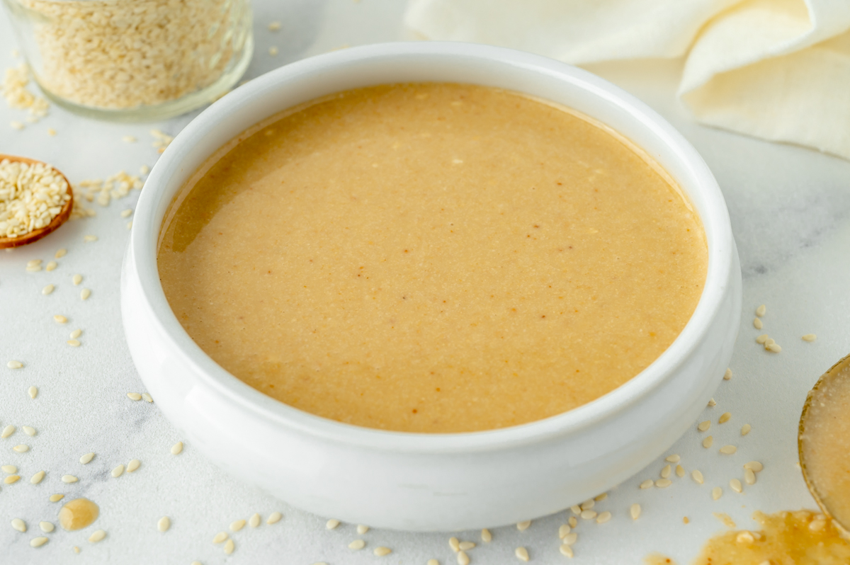 angled shot of bowl of homemade tahini