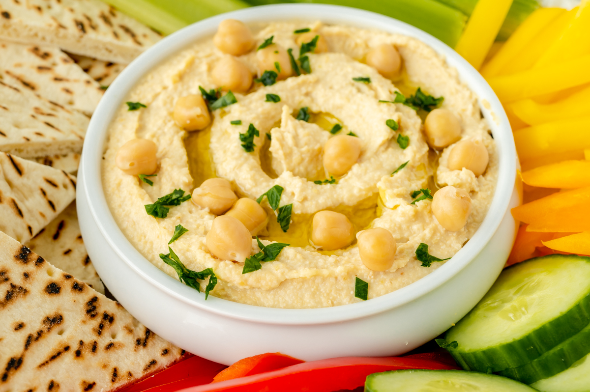 angled shot of bowl of hummus