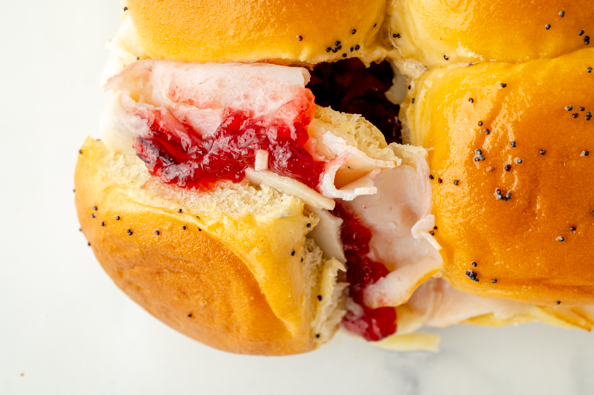 overhead shot of cranberry turkey slider pulled apart