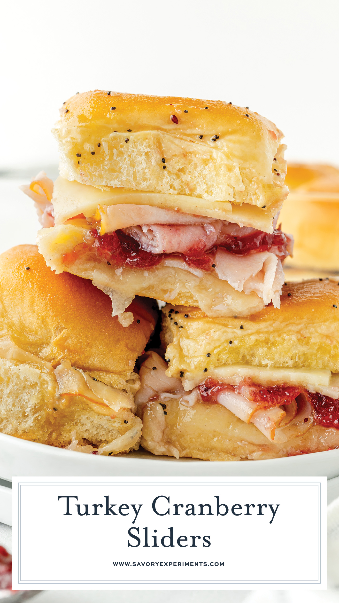 straight on shot of stack of three cranberry turkey sliders with text overlay