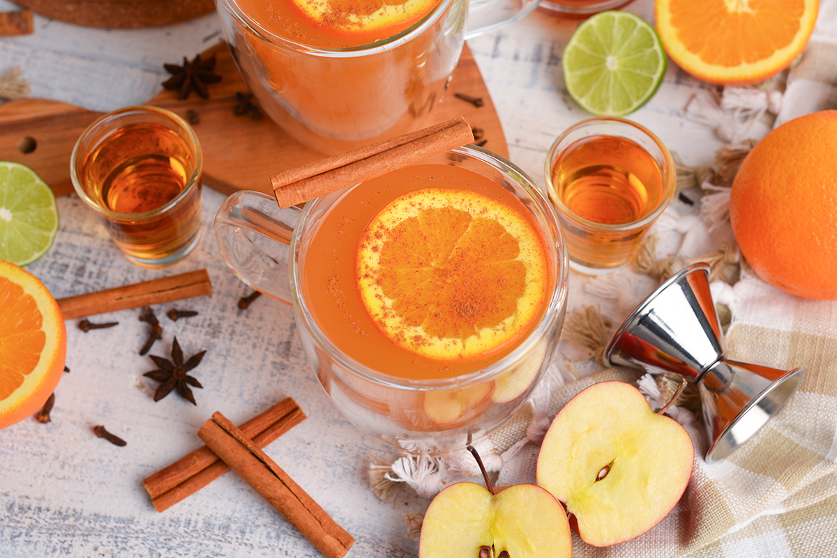 angled shot of mug of wassail with orange slice