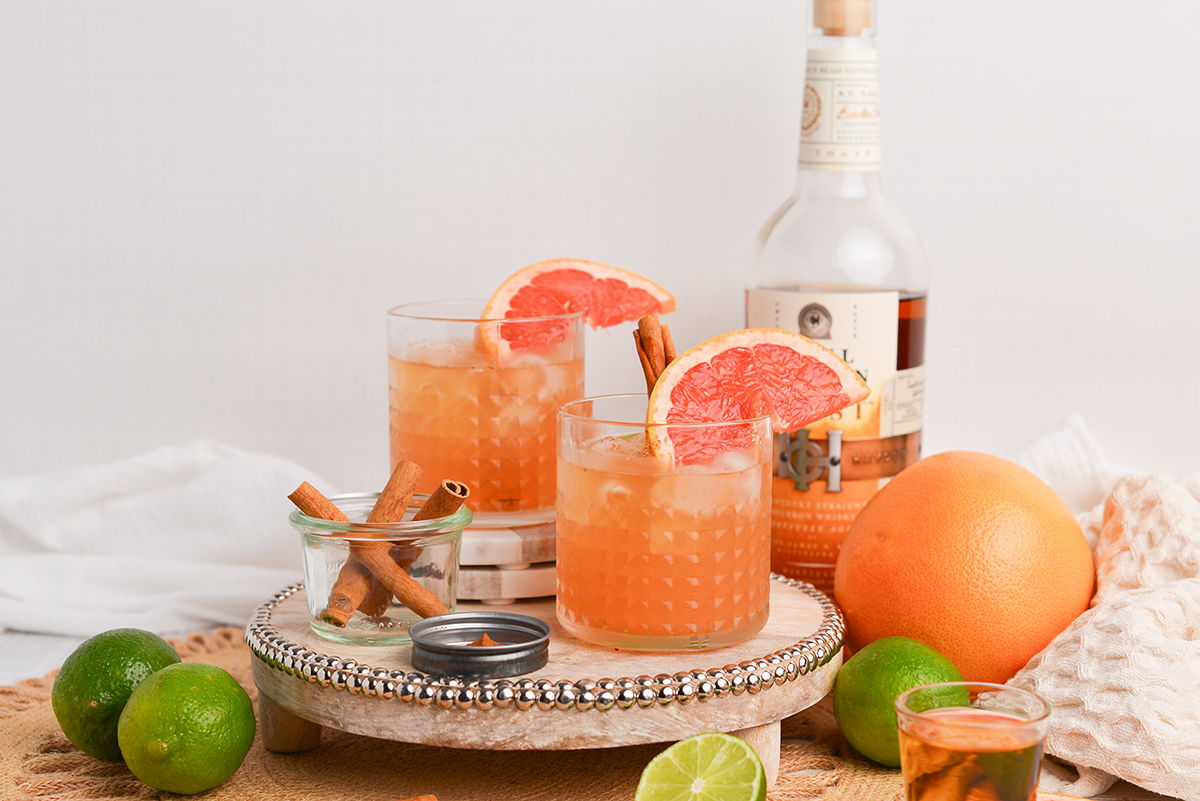 straight on shot of two whiskey grapefruit cocktails