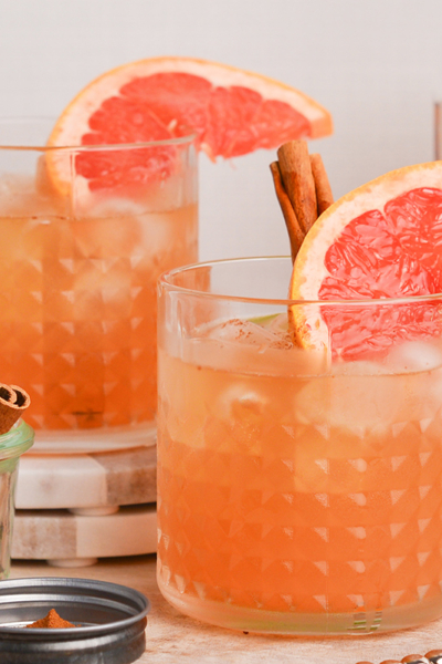 straight on shot of two whiskey grapefruit cocktails