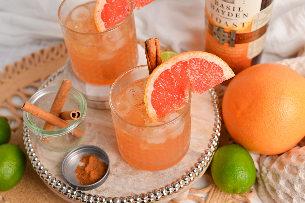 angled shot of two whiskey grapefruit cocktails