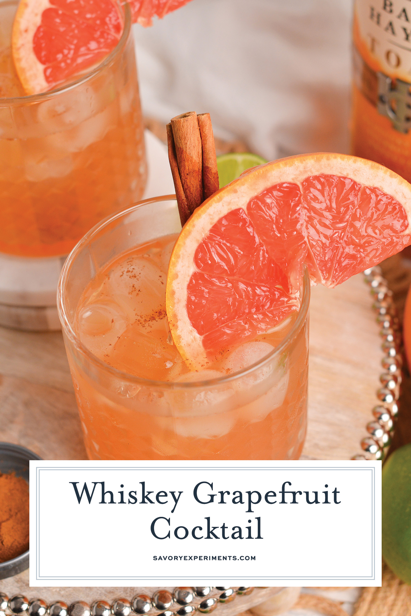 angled shot of whiskey grapefruit cocktail with text overlay