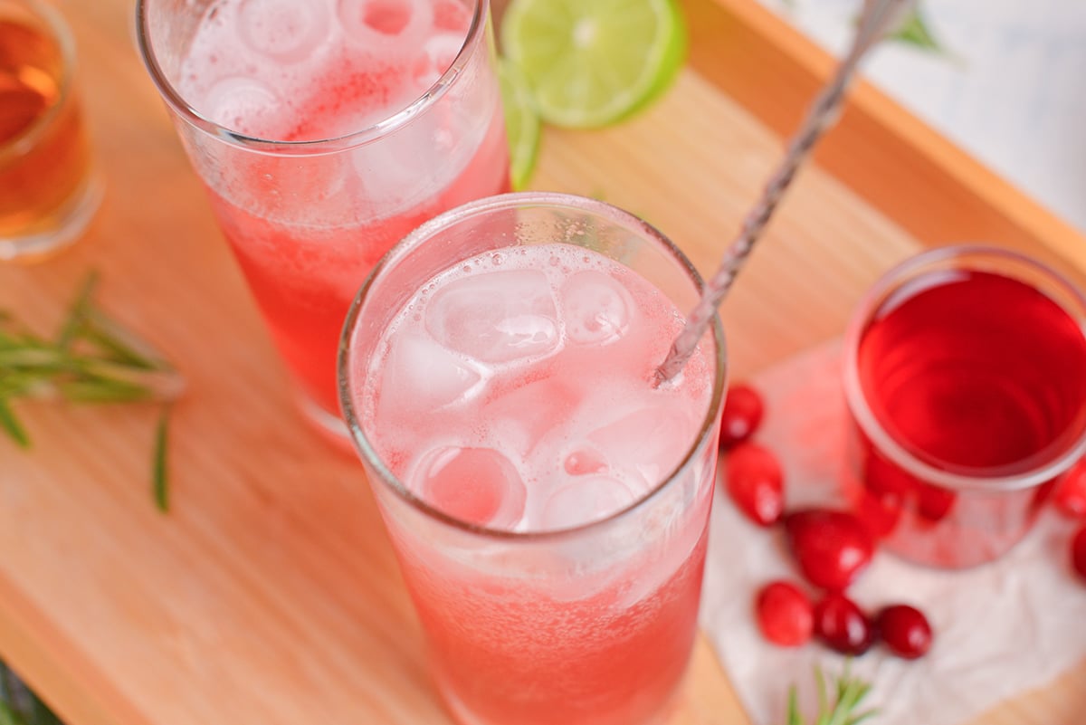 angled shot of stir in cranberry whiskey cocktail