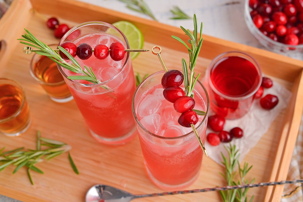 angled shot of to cranberry whiskey sours