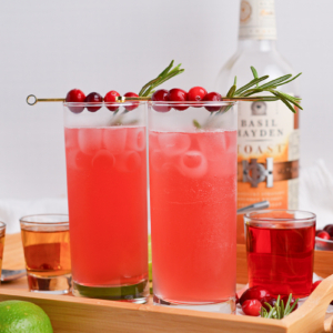 straight on shot of two cranberry whiskey sours