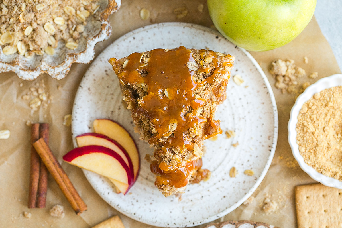 overhead shot of slice of apple cheesecake on plate