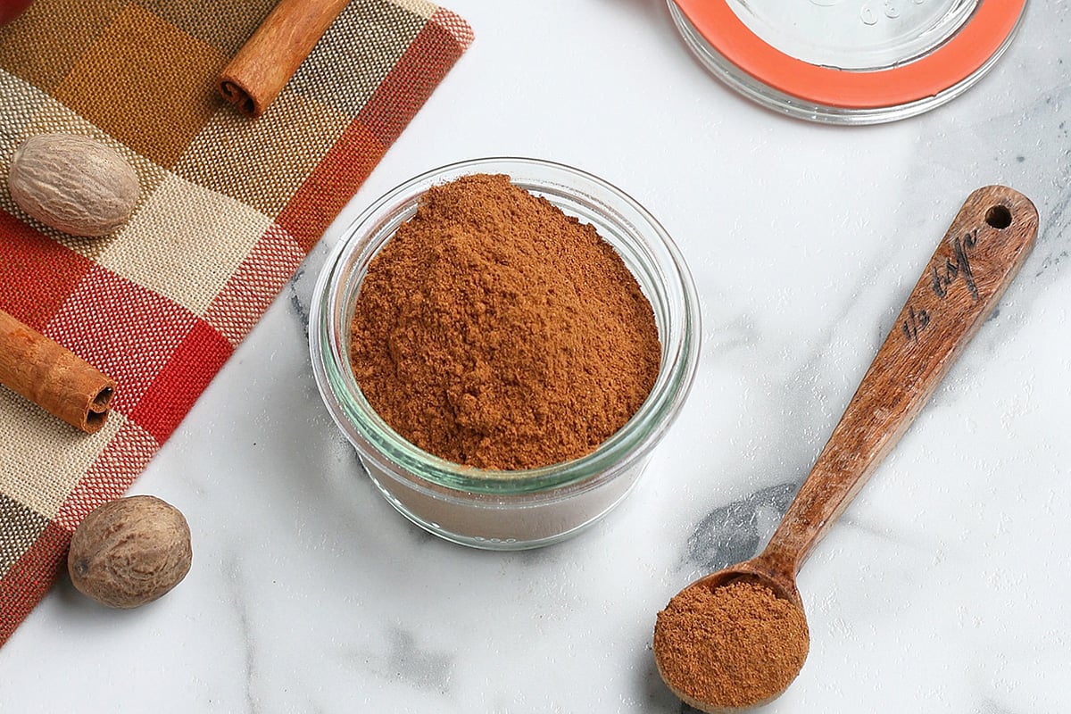 glass container with homemade apple pie spice