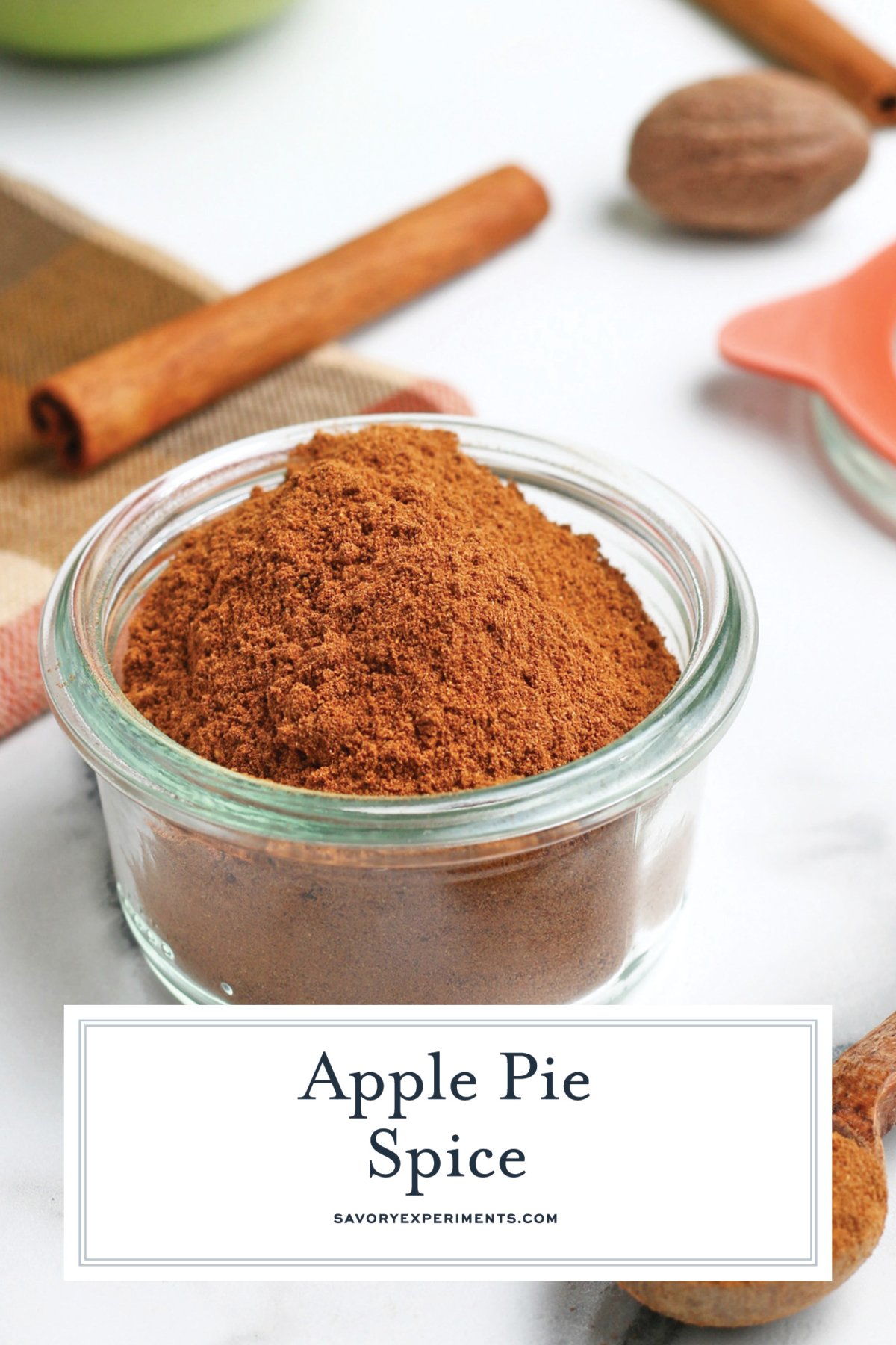 angled shot of jar of apple pie spice with text overlay