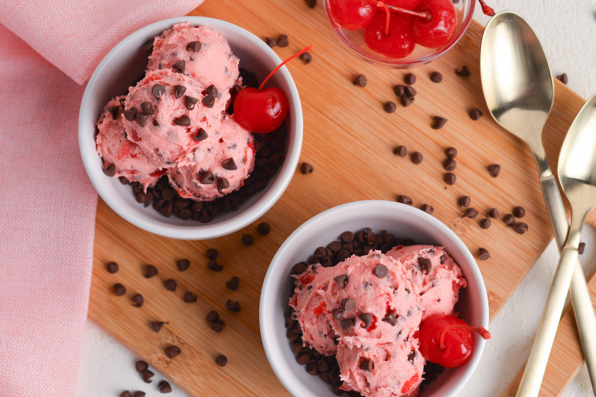 overhead shot of two bowls of chocolate chip cherry cookie dough