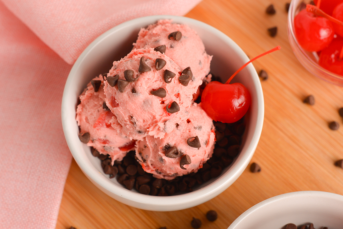 close up overhead shot of bowl of chocolate chip cherry cookie dough