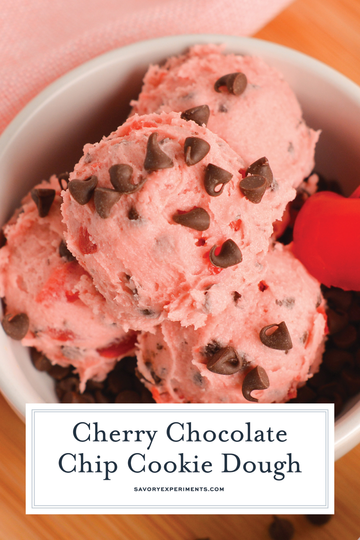 angled shot of bowl of cherry chocolate cookie dough with text overlay