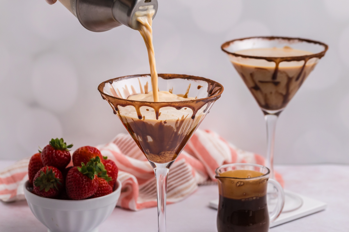 pouring chocolate martini in glass