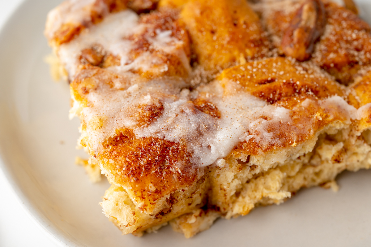 close up angled shot of slice of cinnamon roll casserole