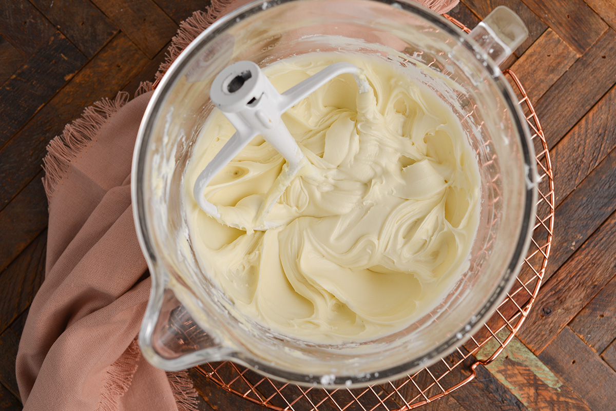 overhead shot of cream cheese frosting in mixer bowl