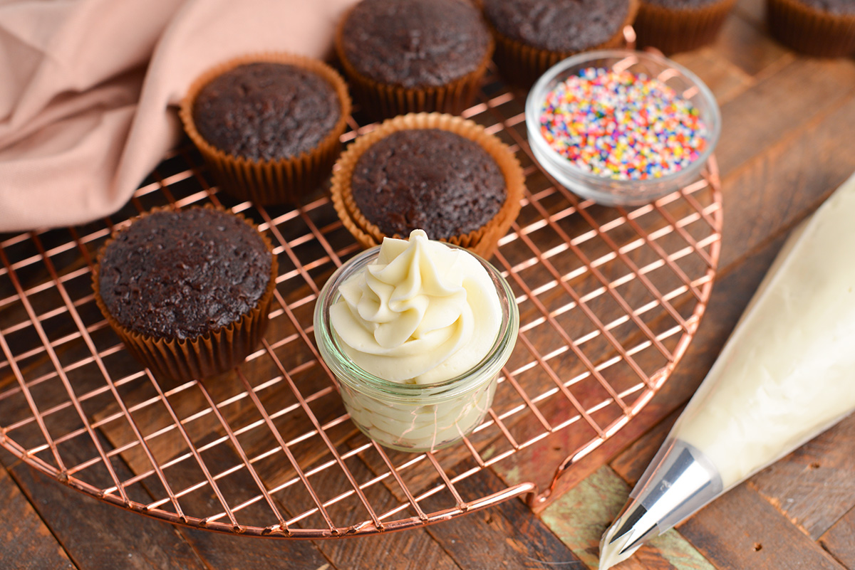 angled shot of jar of cream cheese frosting