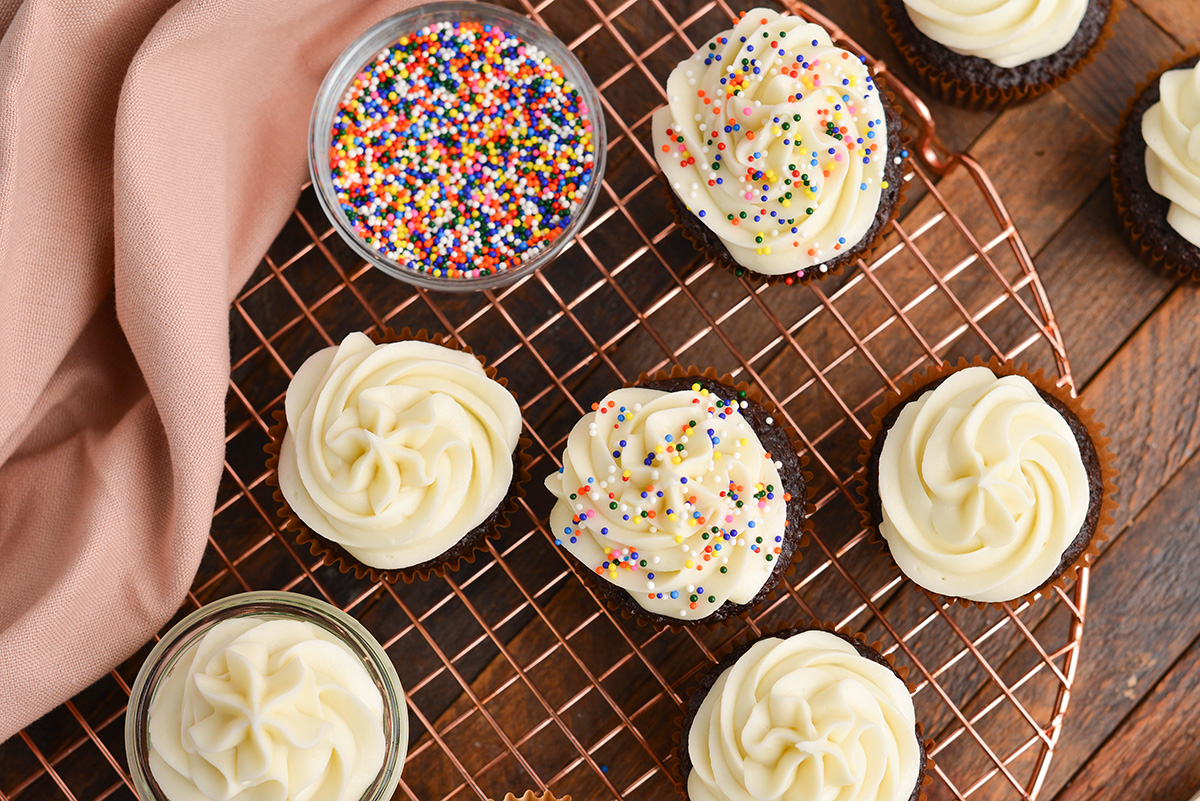 overhead shot of frosted chocolate cupcakes with sprinkles