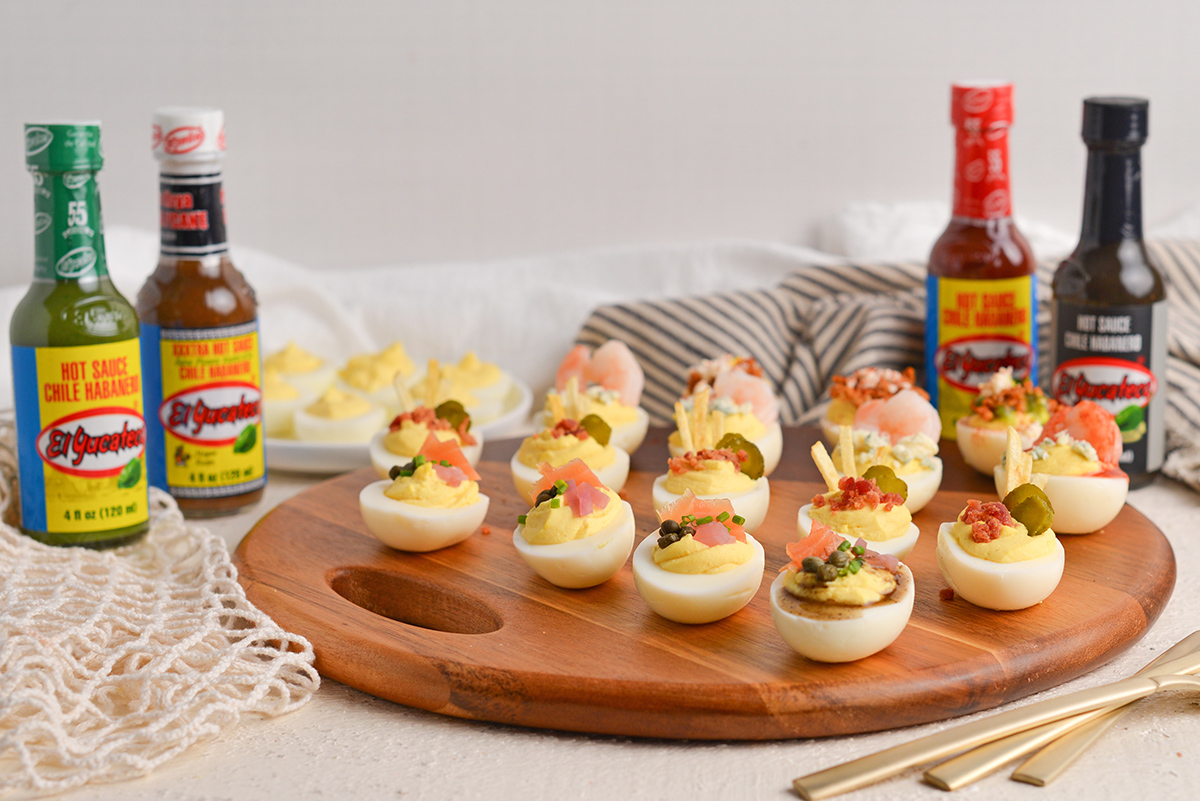 head on view of deviled egg flight on a wood board