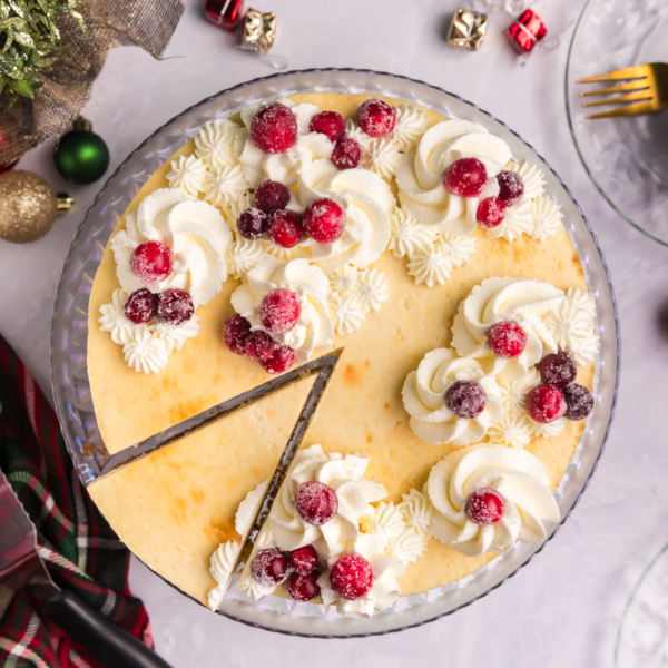 overhead shot of slice cut out of eggnog cheesecake