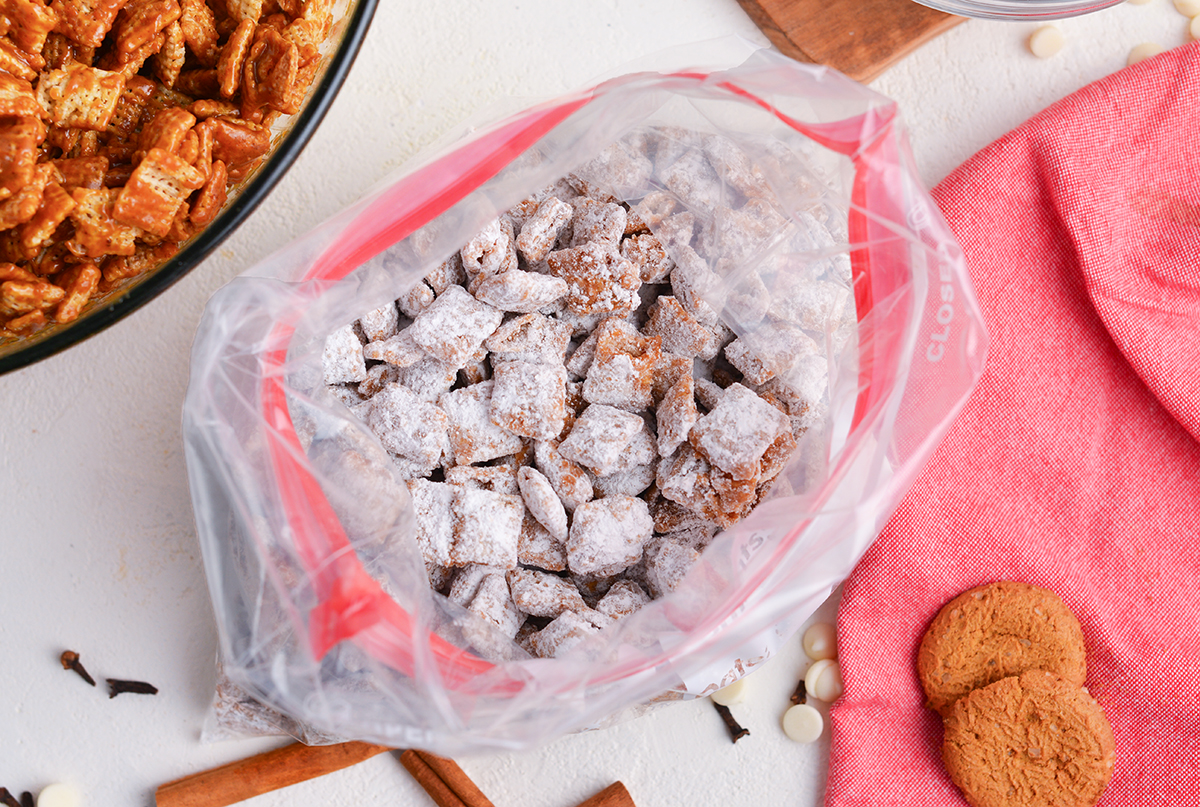 overhead shot of gingerbread puppy chow in plastic bag