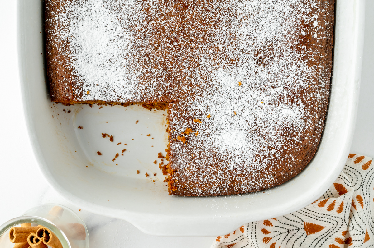 overhead shot of slice taken out of gingerbread snack cake