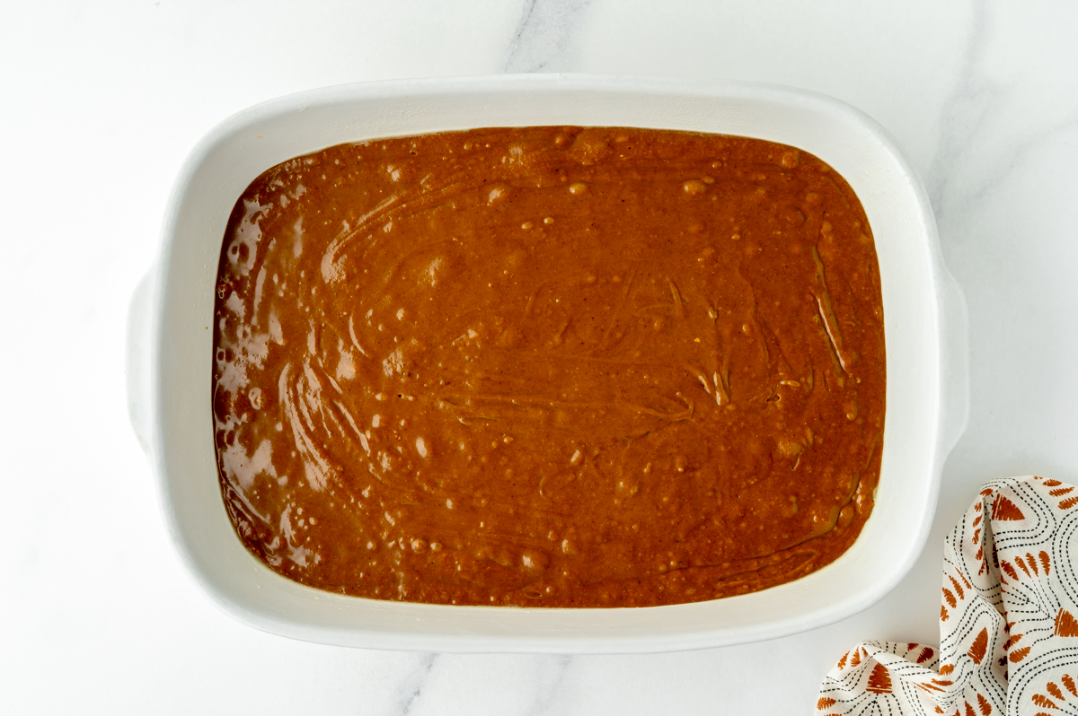 overhead shot of cake batter in baking dish