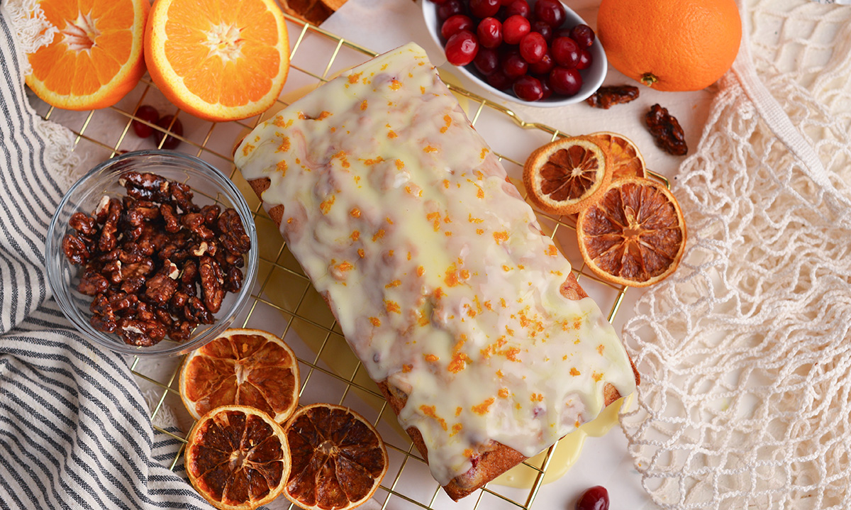 overhead shot of orange glaze over cranberry bread