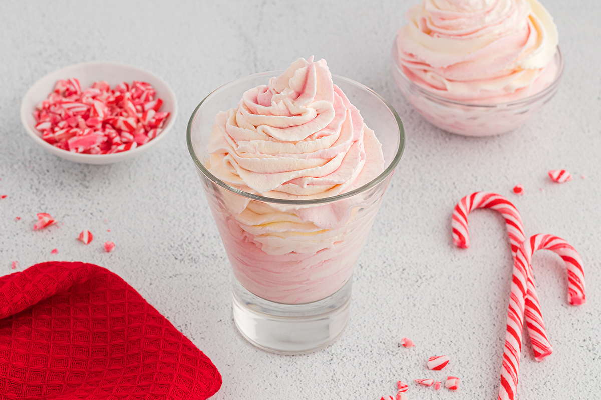 angled shot of glass of peppermint whipped cream