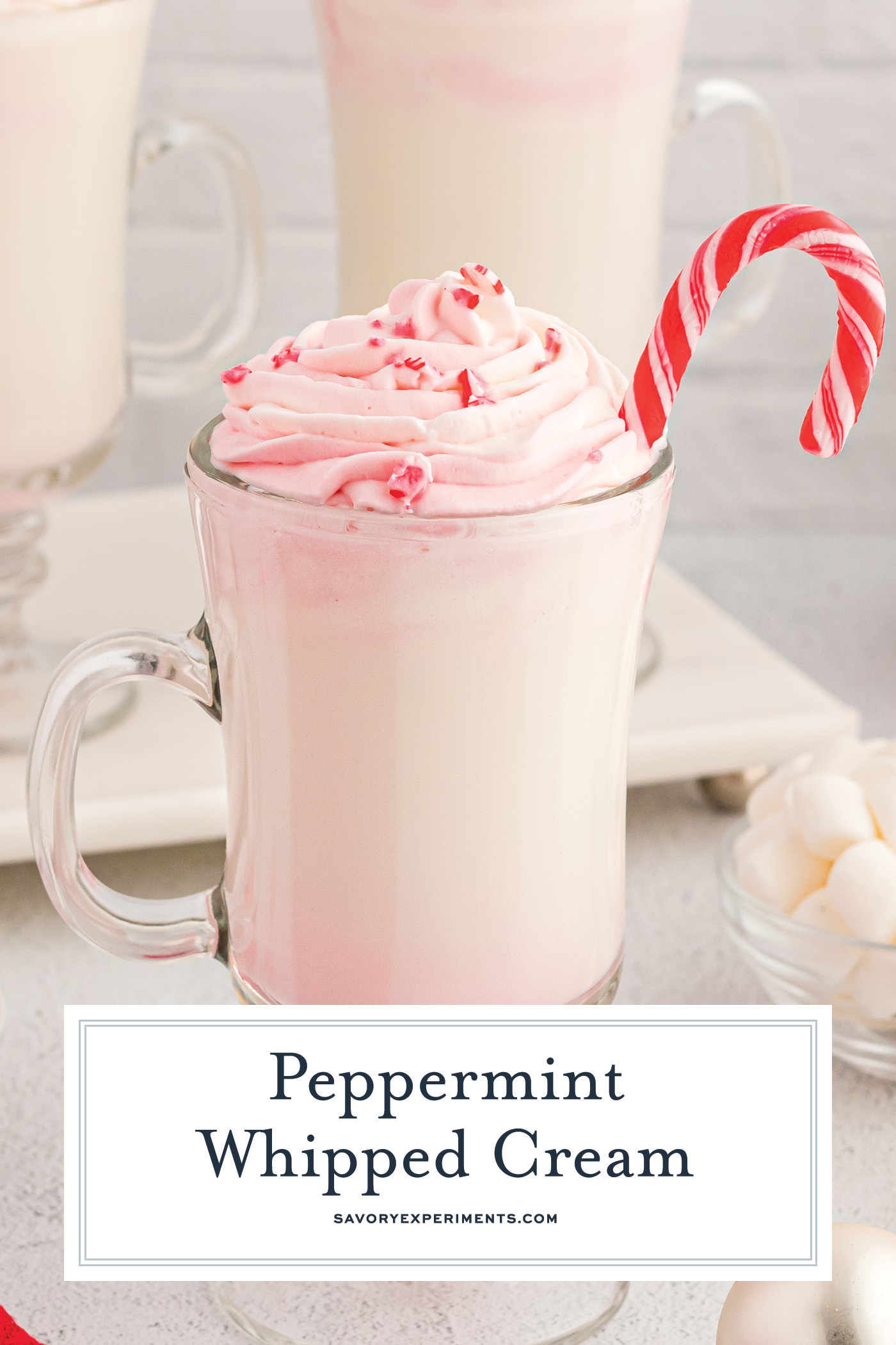 white hot chocolate topped with peppermint whipped cream with text overlay