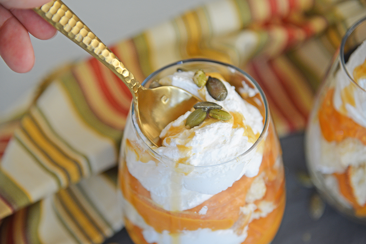 spoon dipping into a no bake pumpkin pie parfait