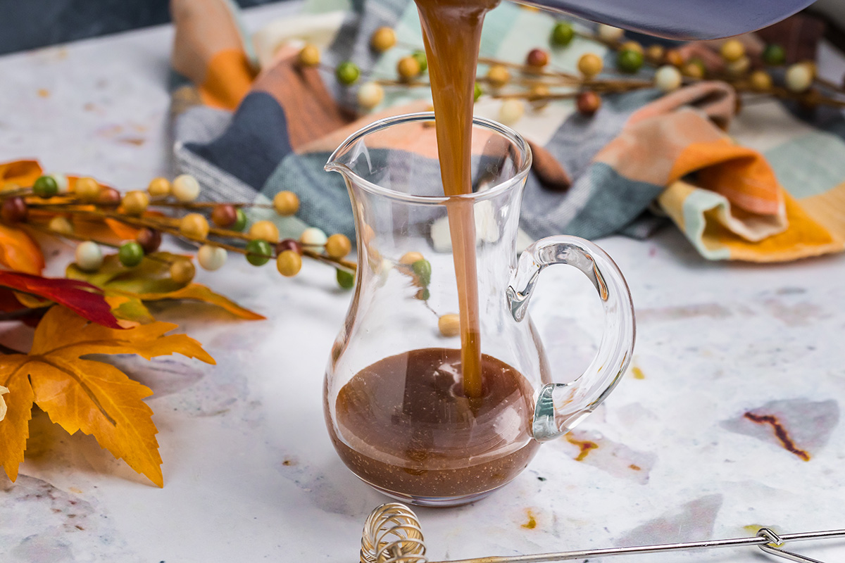 pumpkin syrup pouring into jar