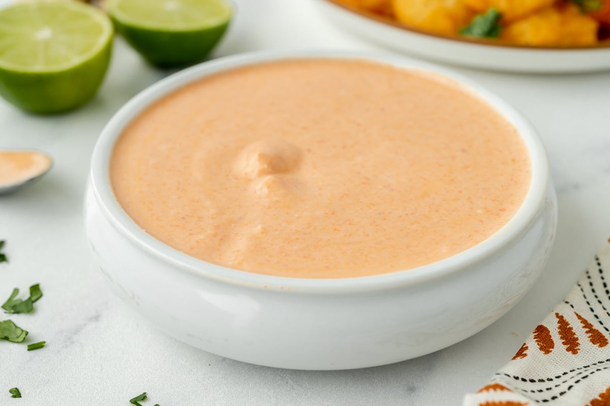 angled shot of bowl of red curry sauce