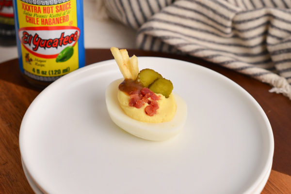 salty and crunchy deviled egg on wood board