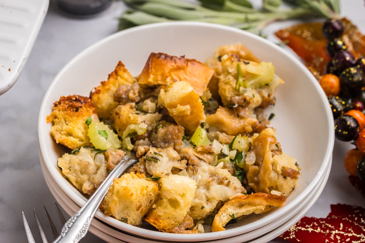 close up angled shot of fork in bowl of stuffing