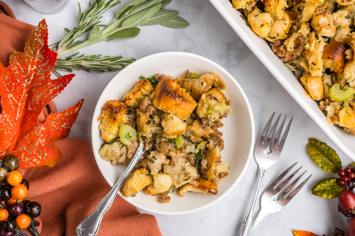 overhead shot of fork in bowl of sausage dressing