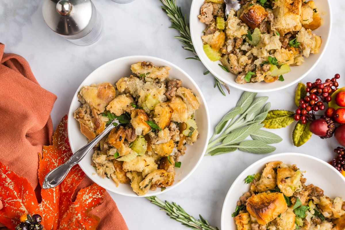 overhead shot of three bowls of sausage dressing