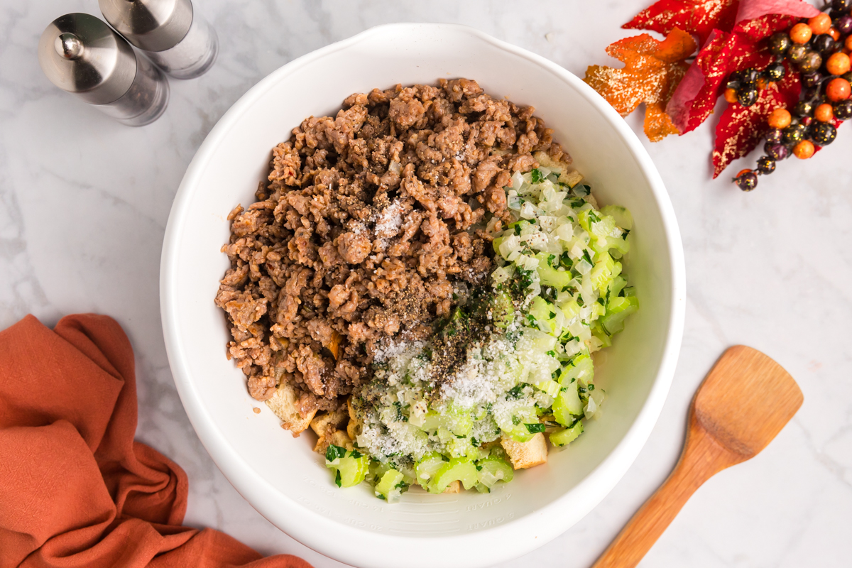 celery, sausage and seasonings in bowl