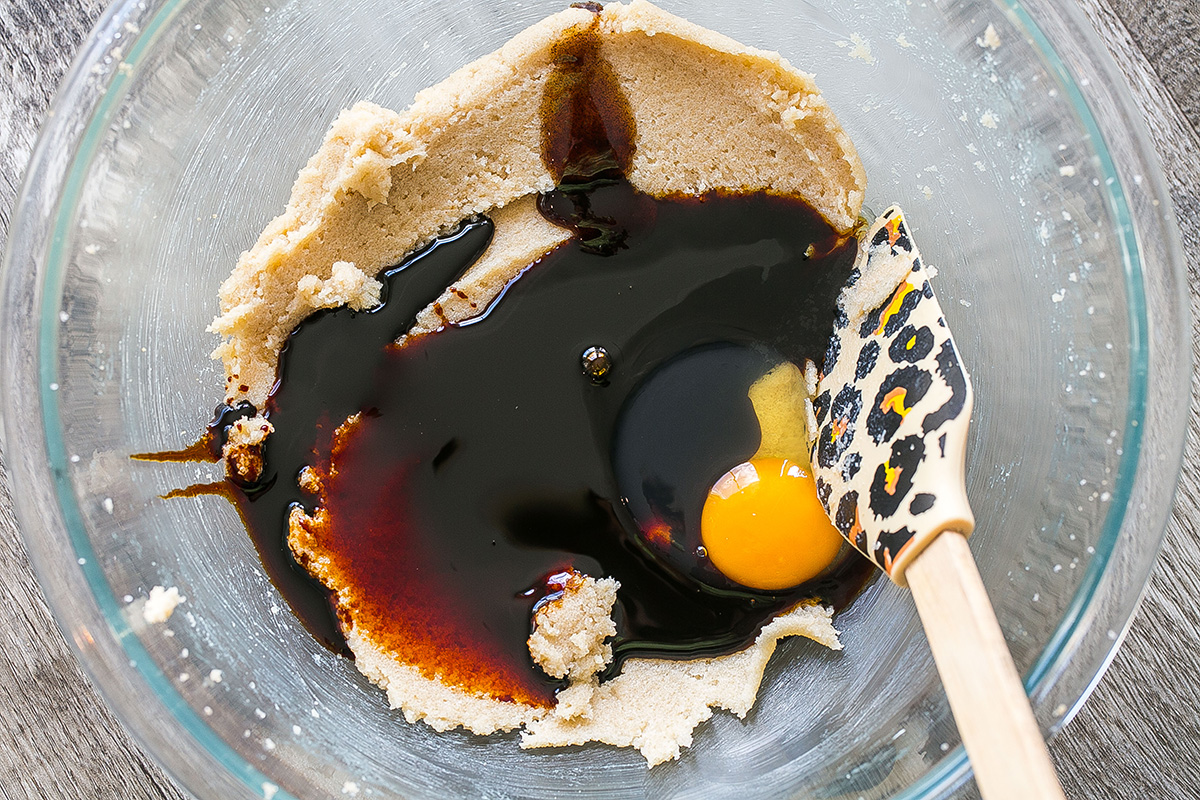 gingerbread cookie ingredients in bowl with spatula