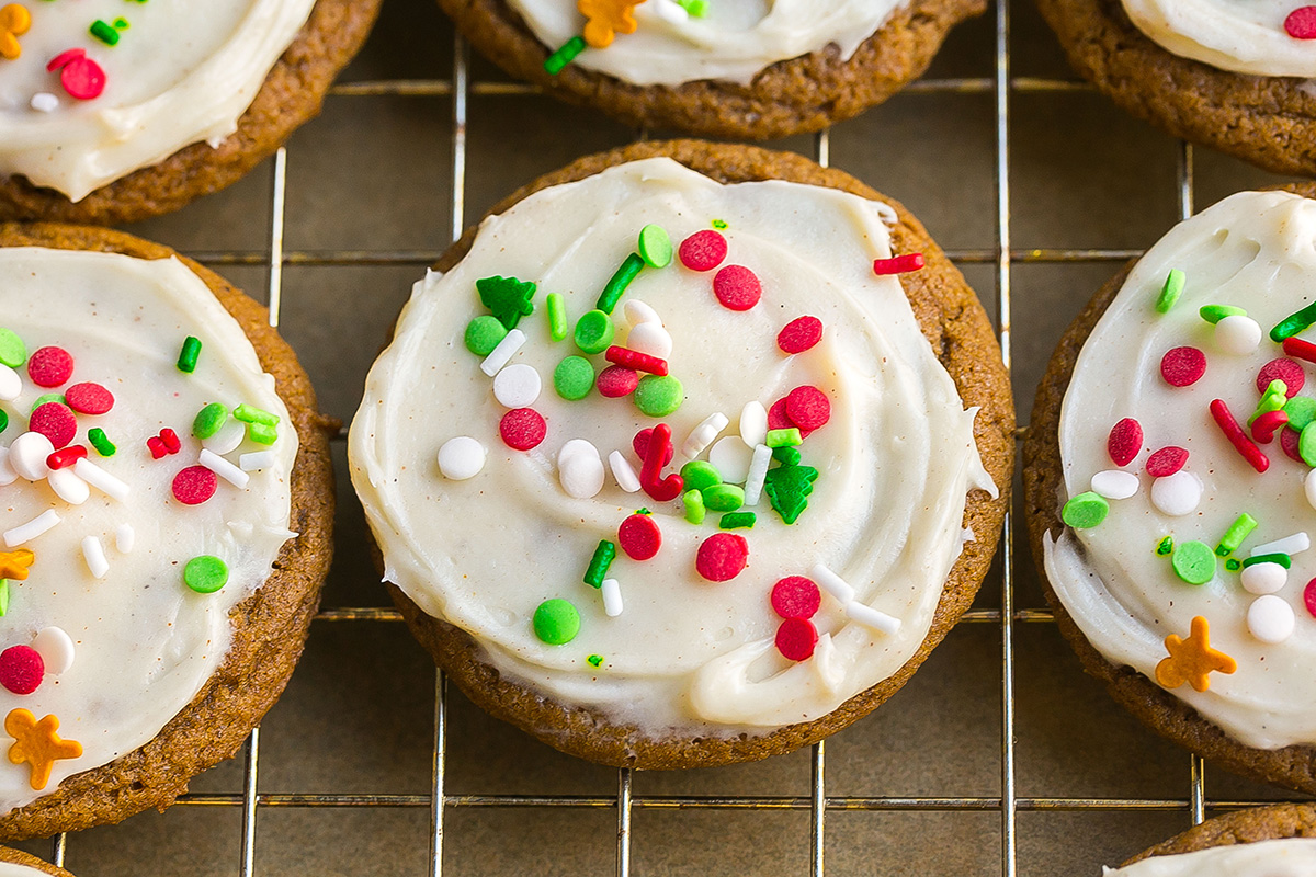 overhead shot of frosted gingerbread cookies on cooling rack