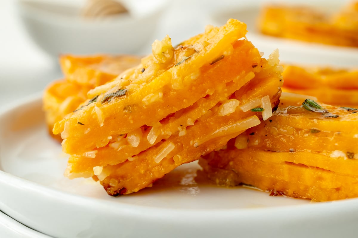 close up of sweet potato stack cut in half on plate