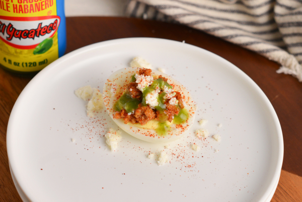 taco deviled egg on wood cutting board