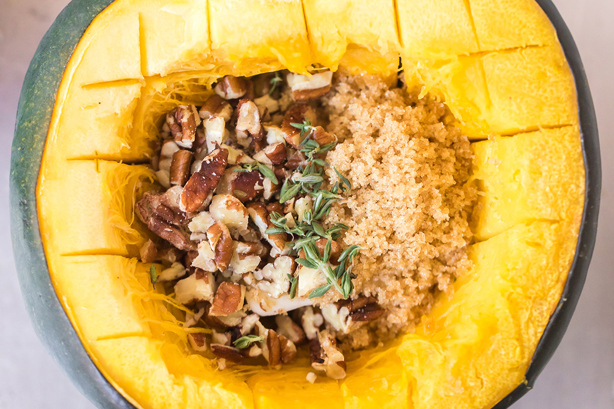 A close up of raw roast acorn squash with filling