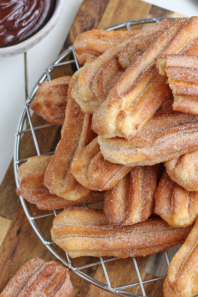 overhead of churros on a wire rack